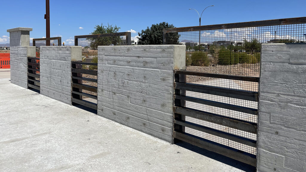 custom welding services - concrete and metal fence sections
